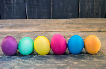 Handmade easter eggs on a wooden table