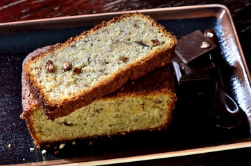 Pieces of banana cake with oat cereals  and chocolate on the plate
