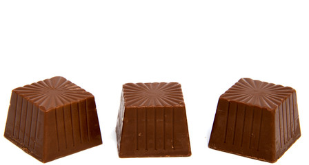 Chocolate candies isolated on white background.