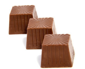 Chocolate candies isolated on white background.