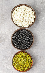 Assortment of dry beans - white, black and green. Selective focus