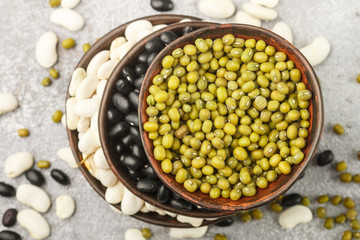Assortment of dry beans - white, black and green. Selective focus
