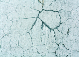 Damaged cyan color old wall surface.