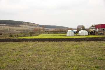Fototapeta na wymiar Plowed land on farm