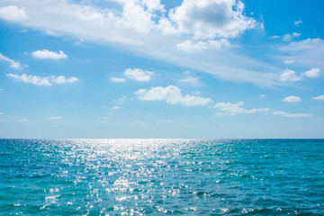 White clouds with blue sky over calm sea  in tropical Maldives island .