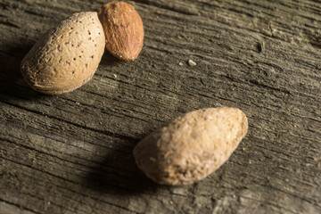 Top view of Almonds over rustic wooden background