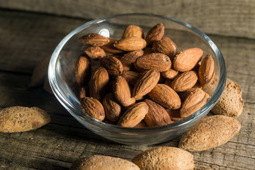 Top view of Almonds over rustic wooden background