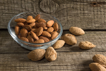 Top view of Almonds over rustic wooden background