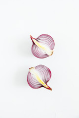 A half-cut violet bow lies on a white table.