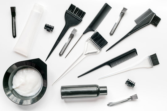 Hair Dye With Brush On White Table Background Top View