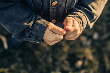 Hands of a homeless child
