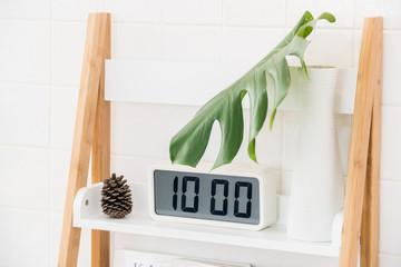 White digital clock on wood shelves,Interior decoration.