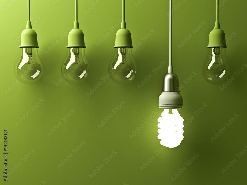 Poster one hanging energy saving light bulb glowing different stand out from unlit incandescent lightbulbs 