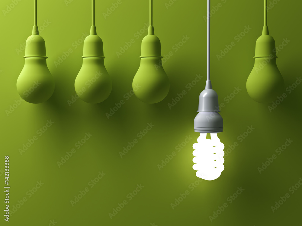 Poster one hanging energy saving light bulb glowing different stand out from unlit incandescent lightbulbs 