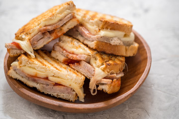 A grilled ham and swiss cheese sandwich