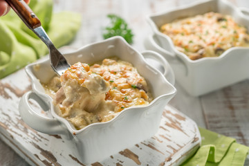 Baked gratin casserole chicken with mushrooms with cheese