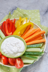 Platter of assorted fresh vegetables with dip