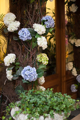 Fototapeta na wymiar entrance decorated with flowers blue white spring