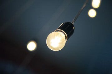 hanging retro light bulb in the cafe or coffee shop interior design loft style modern vintage decoration