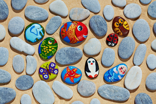 Rounded stones from sea vacation painted, souvenir made by kid