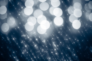 Abstract silver background with white particles. Round bokeh or glitter lights. Design template