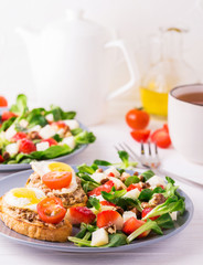 Salad with strawberry, spinach and goat cheese.  Bruschettes