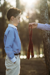 Mother is dressing the child