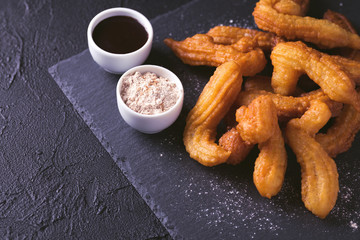 Traditional Spanish and Mexican dessert churros with hot chocolate
