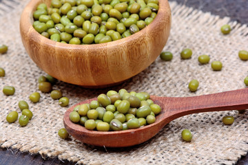 Mung beans in a wooden spoon and bowl