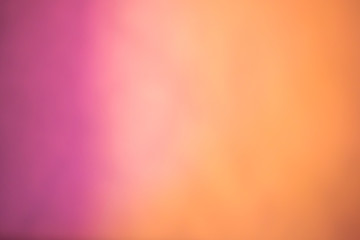 Pink to orange blurred Background