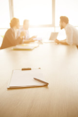 Toned focus on contract for new worker. Freelancer and businessmen represented on background....