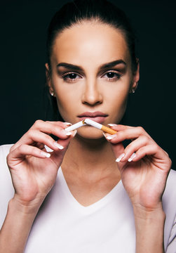 girl quit smoking concept break cigarette