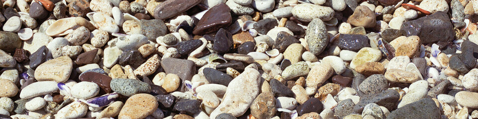 Banner of small sea pebbles