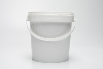 Plastic can for food with a handle.