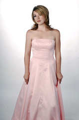 Young Beautiful Woman in Formal Pink Gown