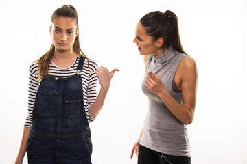 two girls having heavy talk argue conflict concept 