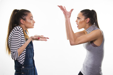 two girls having heavy talk argue conflict concept 