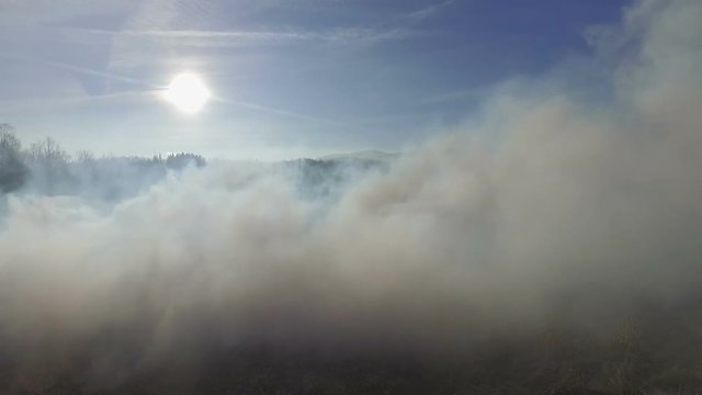 Old castle on fire, in the mountains, aerial video