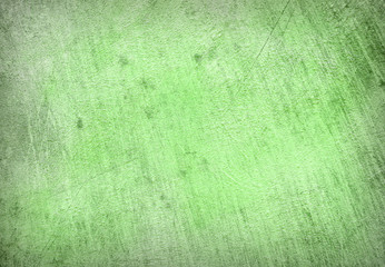 Abstract Background of a concrete wall fragment in green color