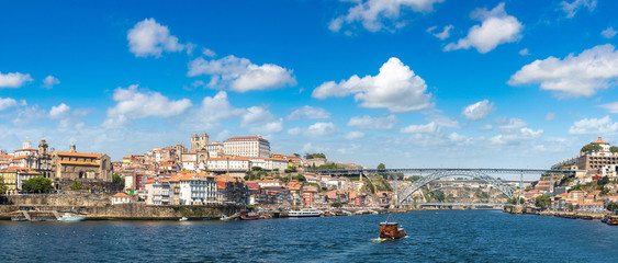 Fototapeta na wymiar Tourist boat and Douro River in Porto