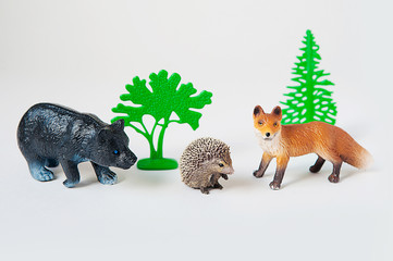 little animal toys Fox, bear and hedgehog on white background