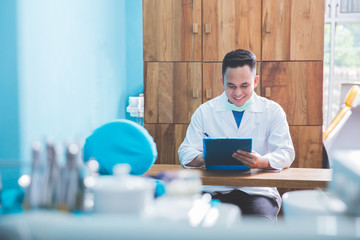 dentist talking to his patient at dental care clinic