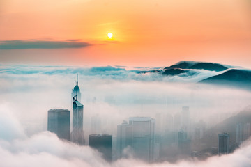 Obraz premium Foggy and Cloudy view of Victoria harbor at Hong Kong 