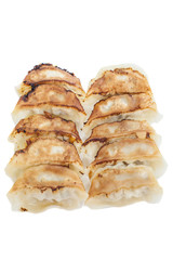 Japanese Gyoza , dumplings filled with ground meat and vegetables and wrapped in a thin dough