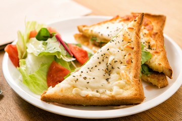 Cheese On Toast Being Grilled In Oven