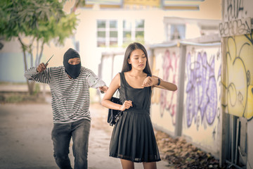 Street thief holding knife and trying to steal