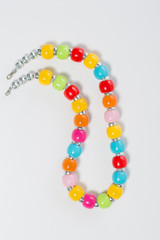 Multicolored beads on a white