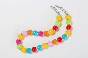 Multicolored beads on a white