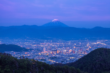 Mount Fuji and Kofu city at night time