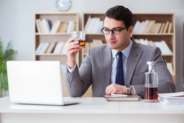 Businessman drinking in the office
